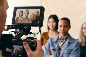 videographer filming group of multiethnic women fo 2024 12 04 19 22 41 utc min